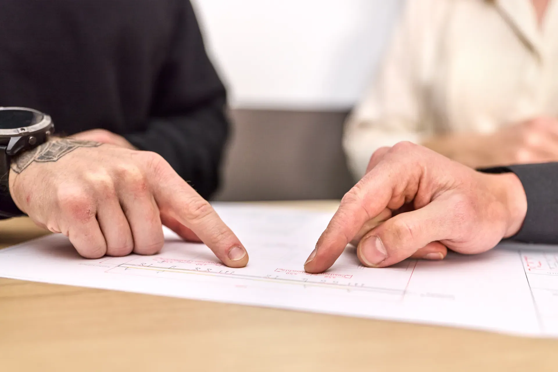 Employees look at a drawing