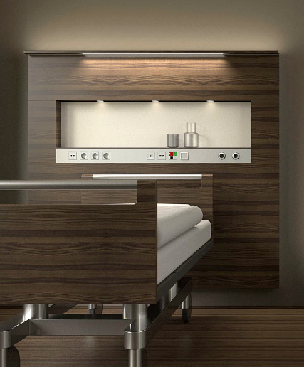 A patient room with a modular medical supply unit from Schyns