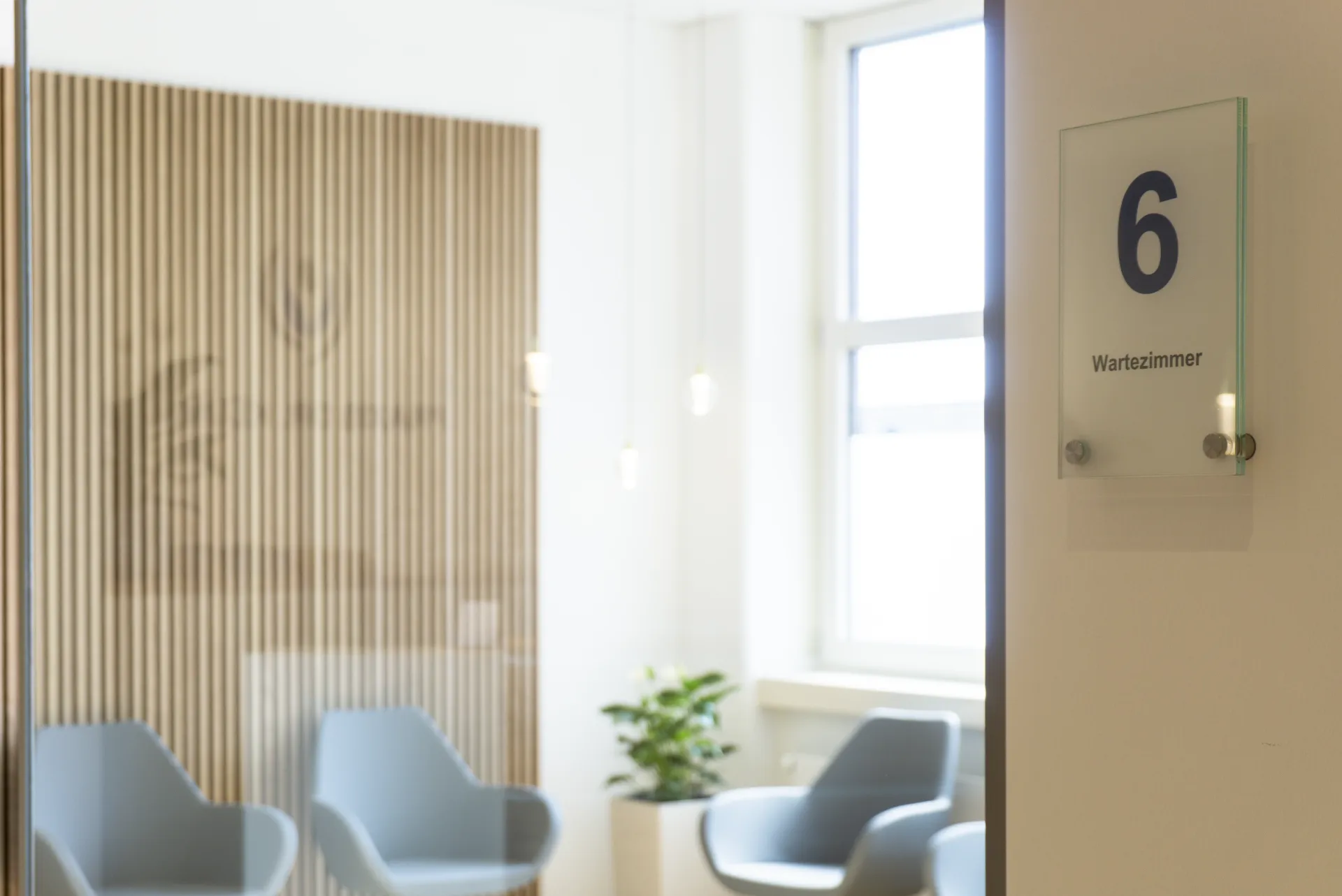 View through a glass door into waiting room 6.