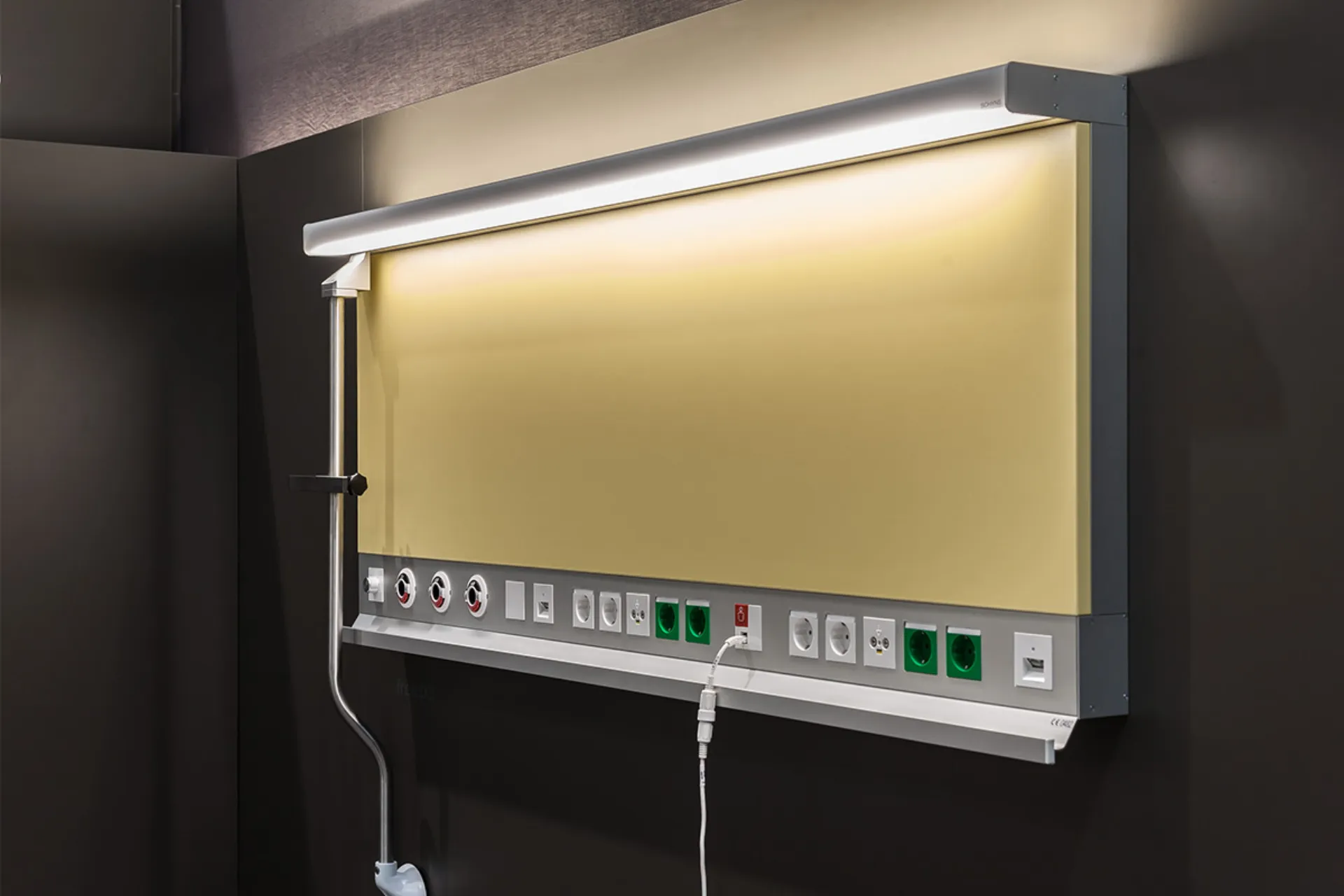 Wall panel with medical connections and lighting in a hospital room